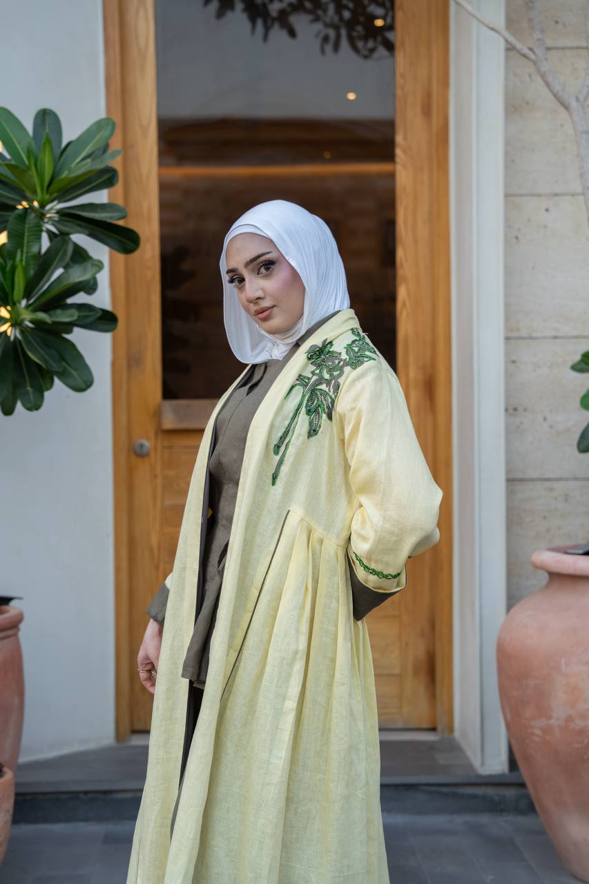 Yellow linen trench coat with hand embroidery and beading.C:1095