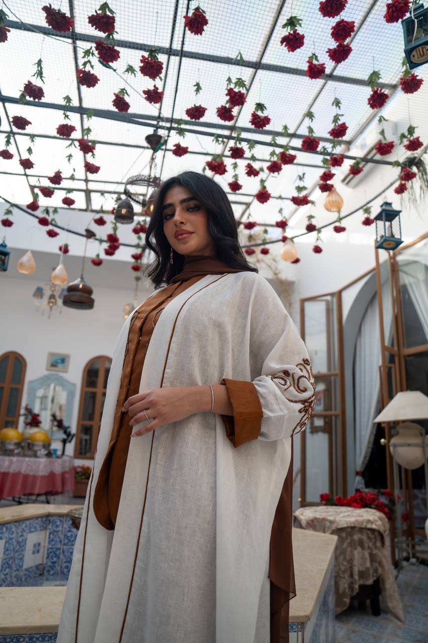 White linen abaya with hand-stitched details. C:J1082