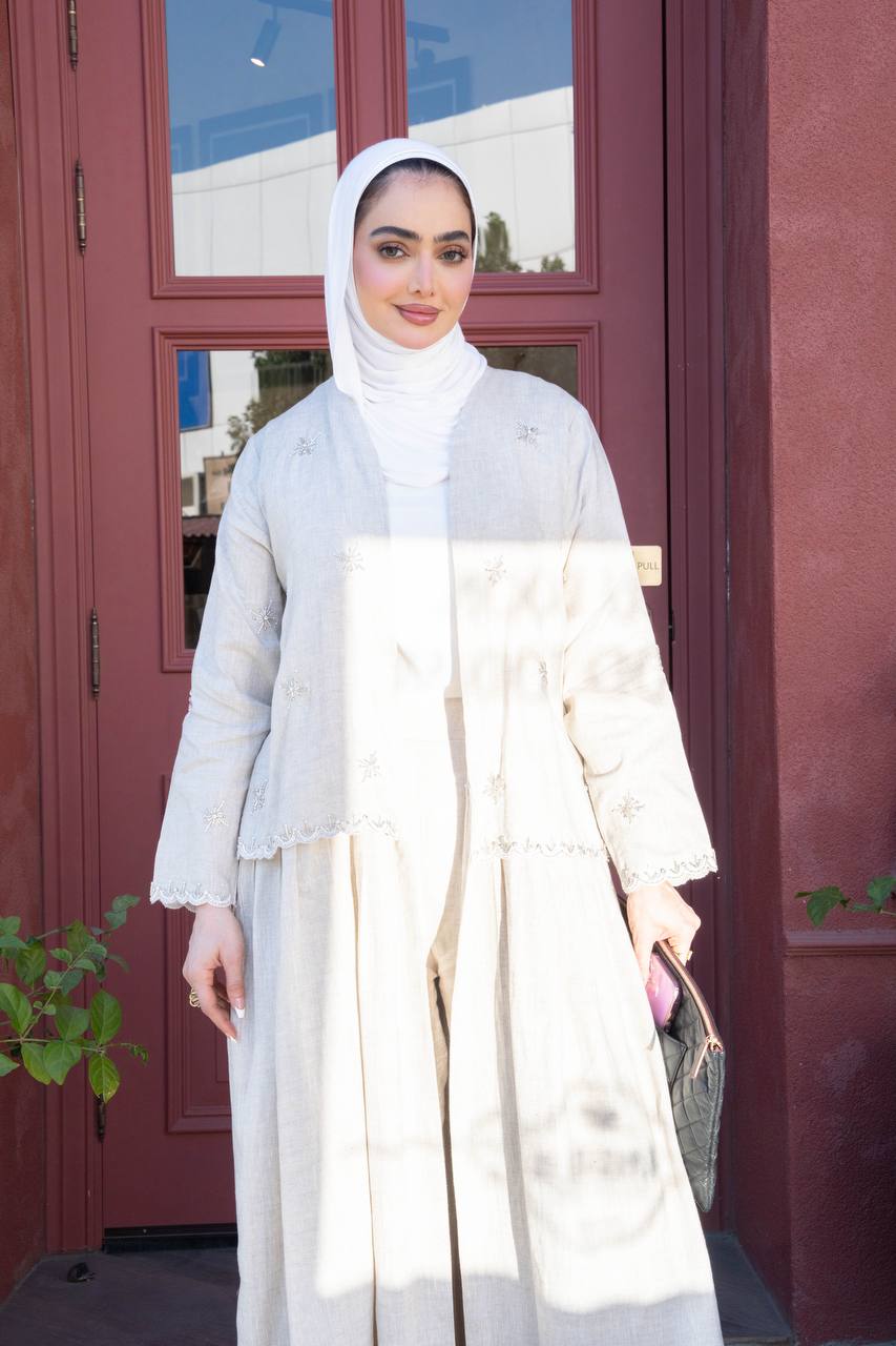 Light beige linen trench coat with hand-stitched detailing.C:J1081