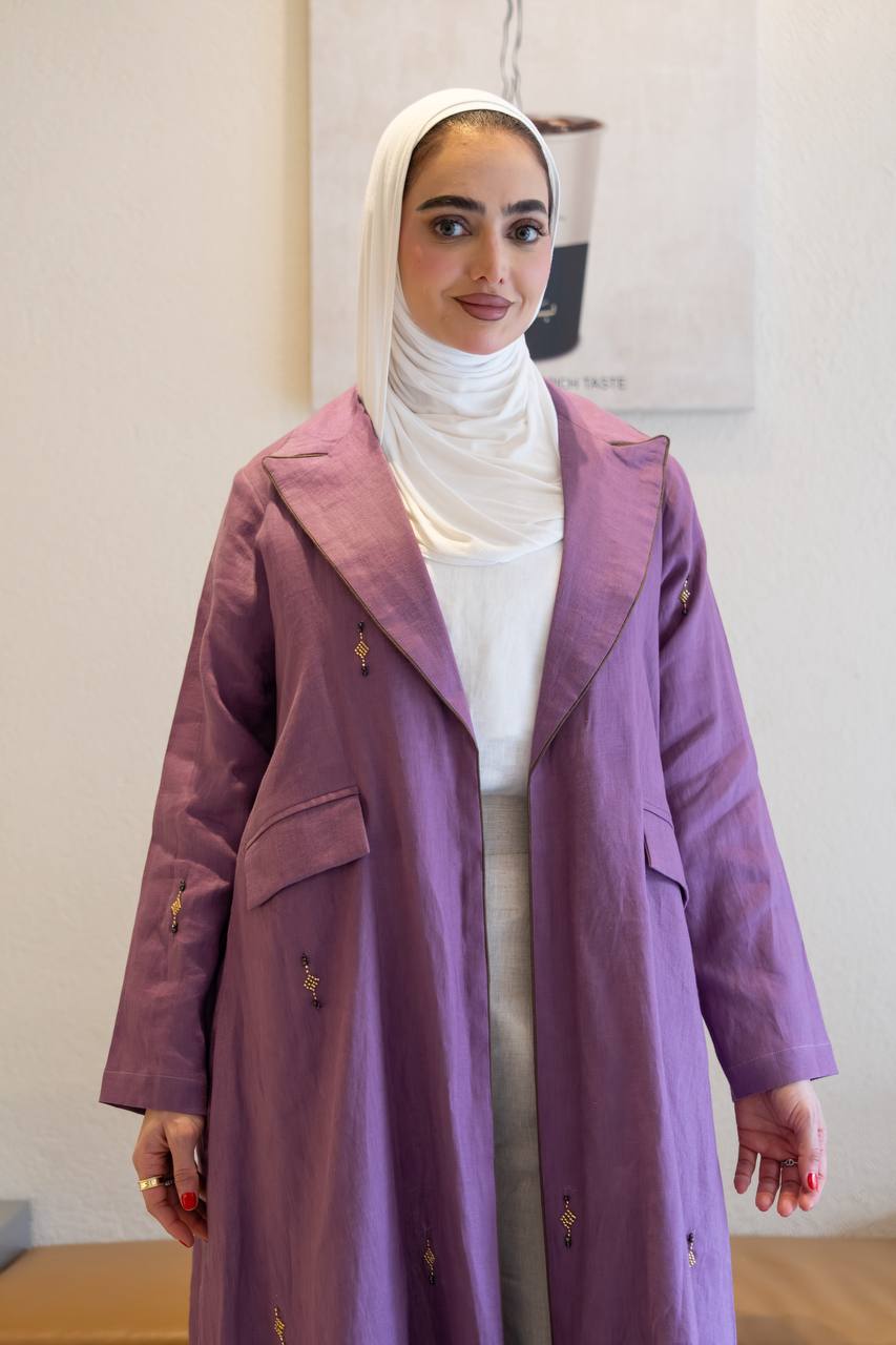 Purple linen trench coat with hand-stitched detailing.C:1096