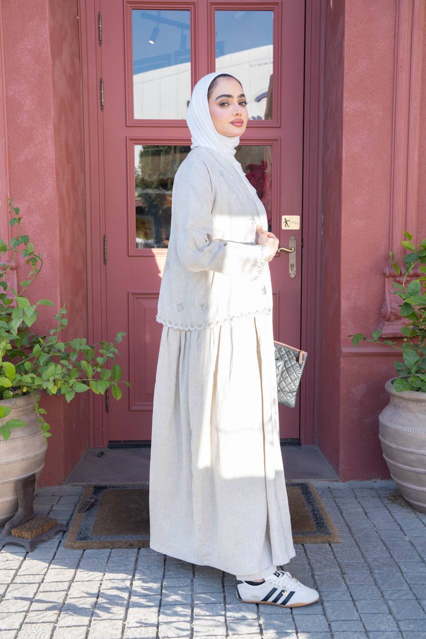 Light beige linen trench coat with hand-stitched detailing.C:J1081