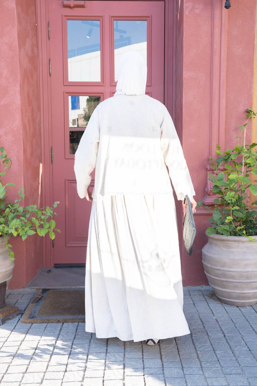 Light beige linen trench coat with hand-stitched detailing.C:J1081