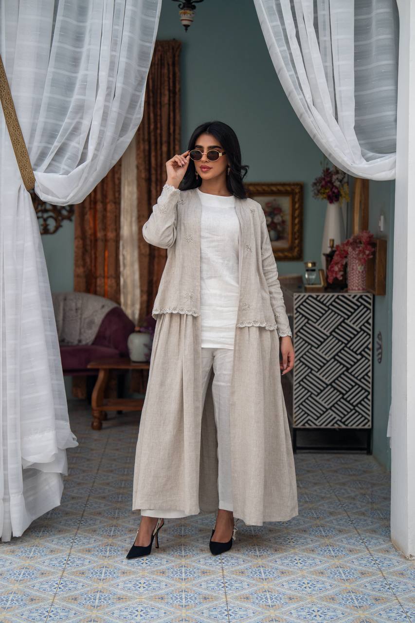 Light beige linen trench coat with hand-stitched detailing.C:J1081