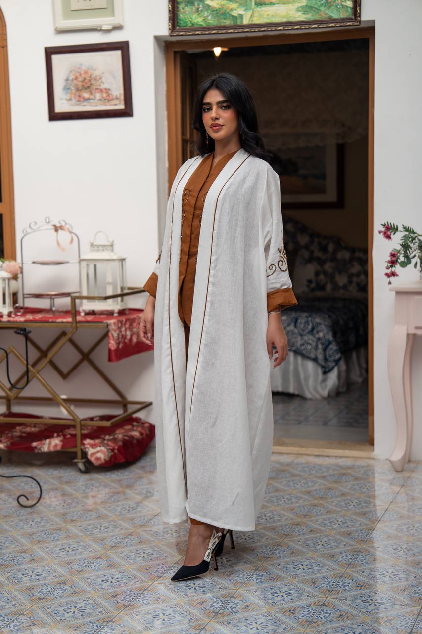 White linen abaya with hand-stitched details. C:J1082