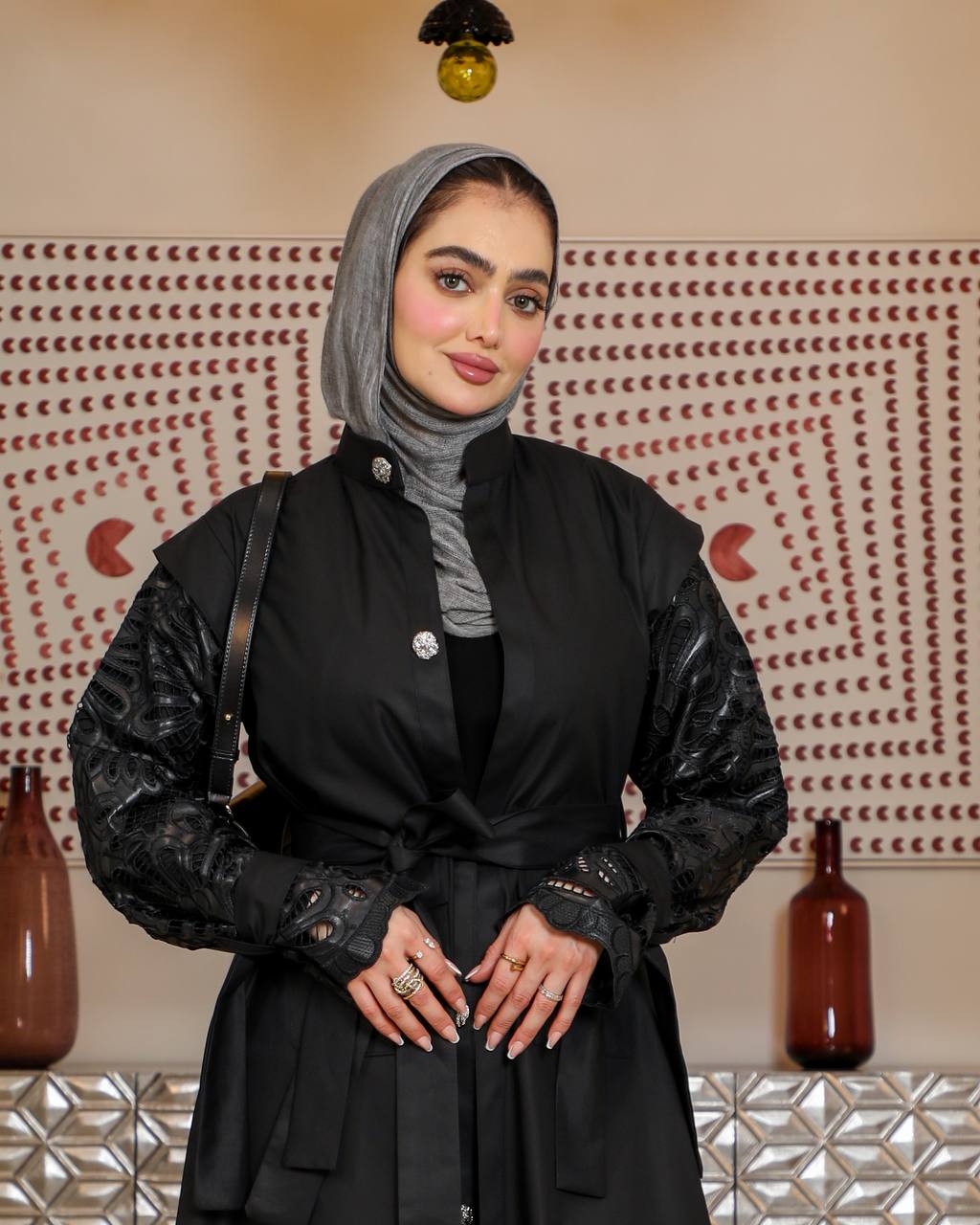 Trench coat with leather on the sleeves. C:J1075