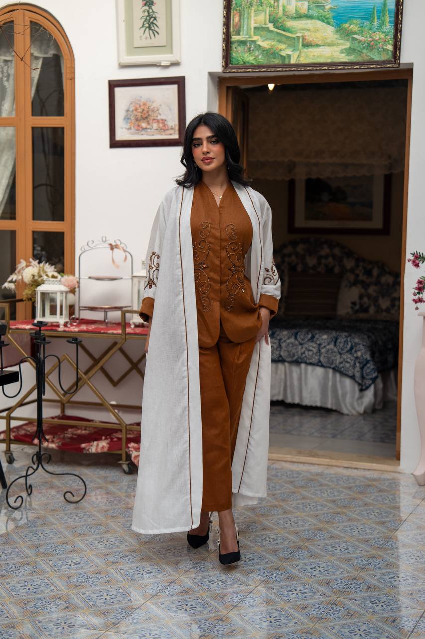 White linen abaya with hand-stitched details. C:J1082