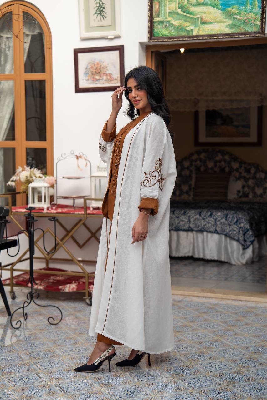 White linen abaya with hand-stitched details. C:J1082