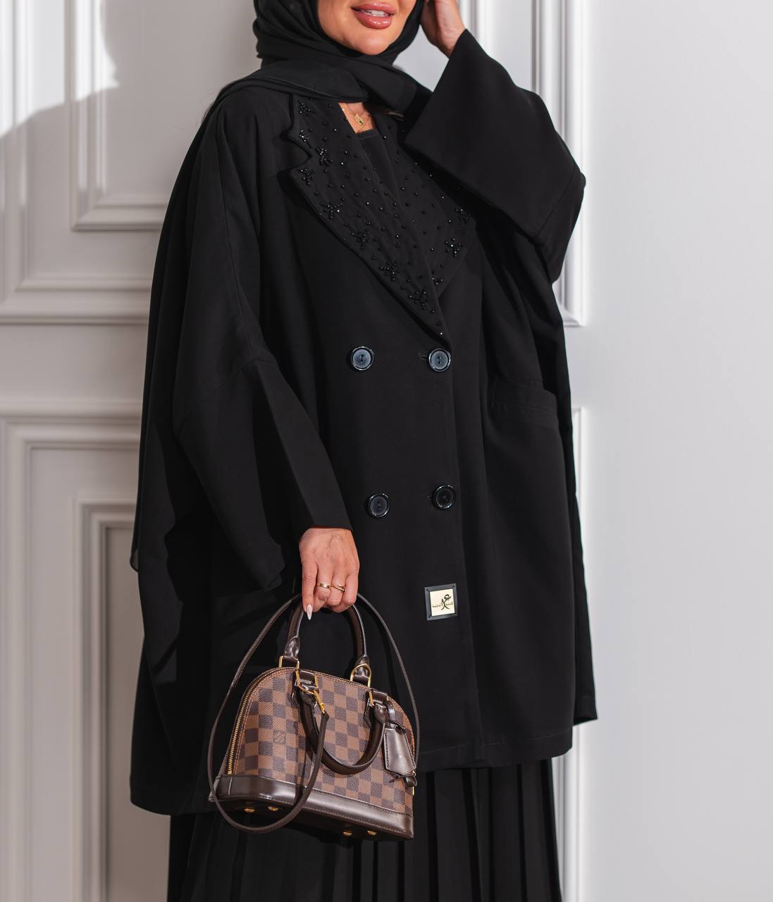 Black crepe skirt and blazer set.C:J6516