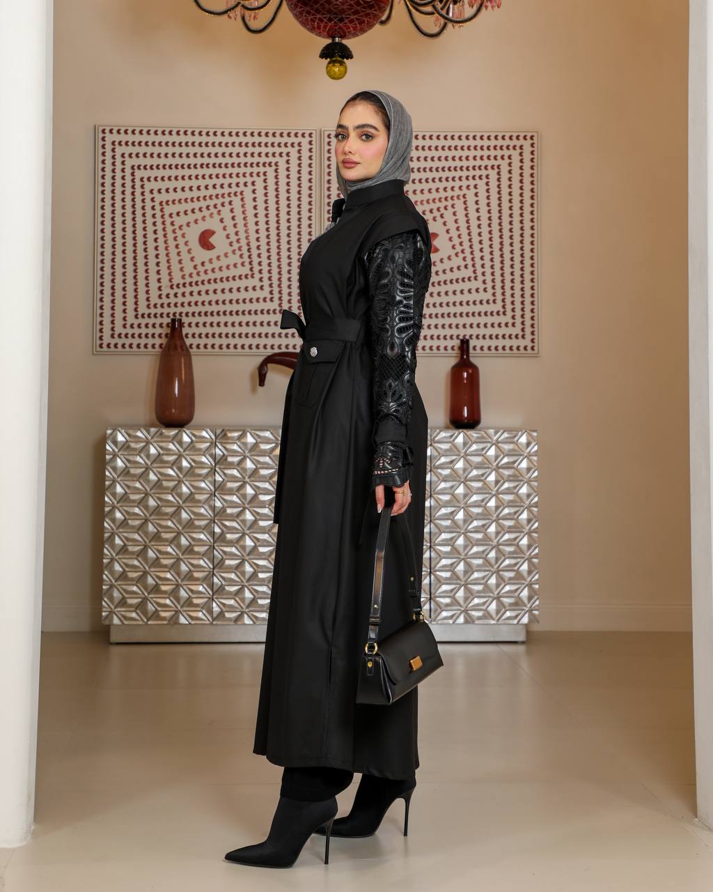 Trench coat with leather on the sleeves. C:J1075