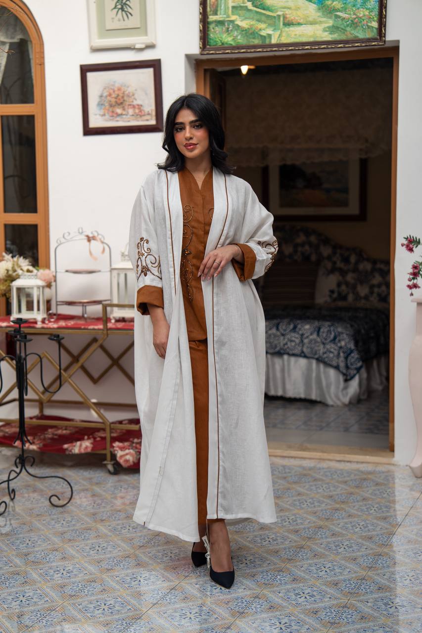 White linen abaya with hand-stitched details. C:J1082