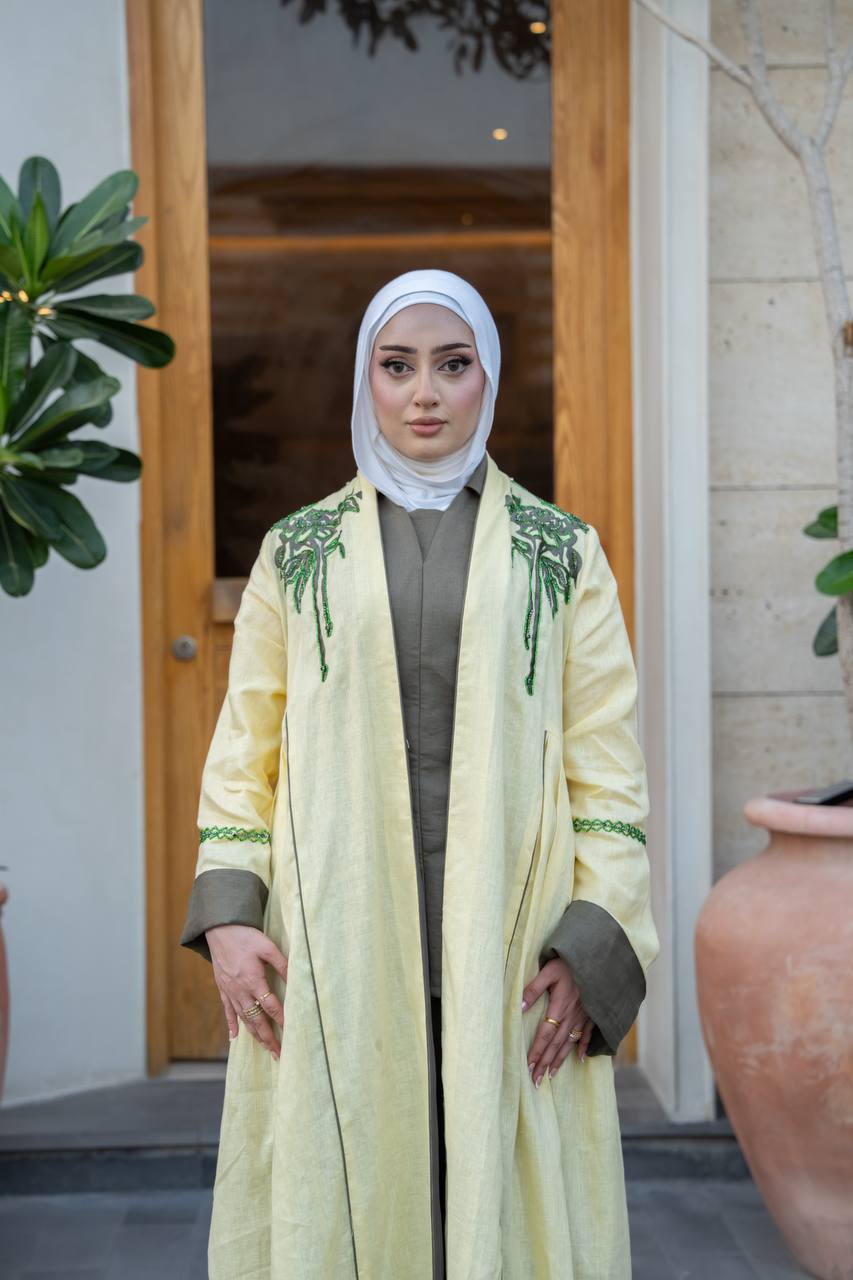 Yellow linen trench coat with hand embroidery and beading.C:1095
