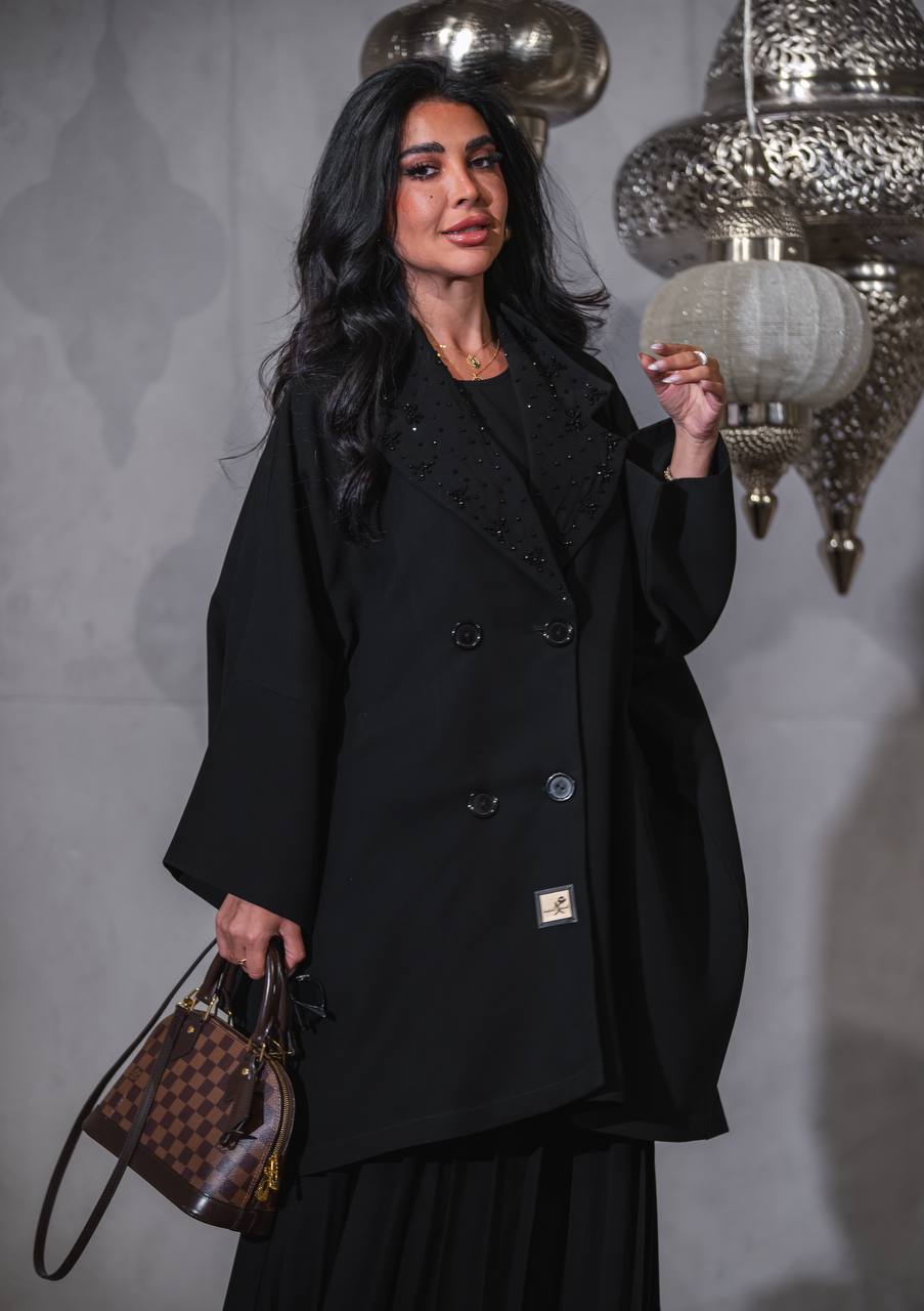 Black crepe skirt and blazer set.C:J6516