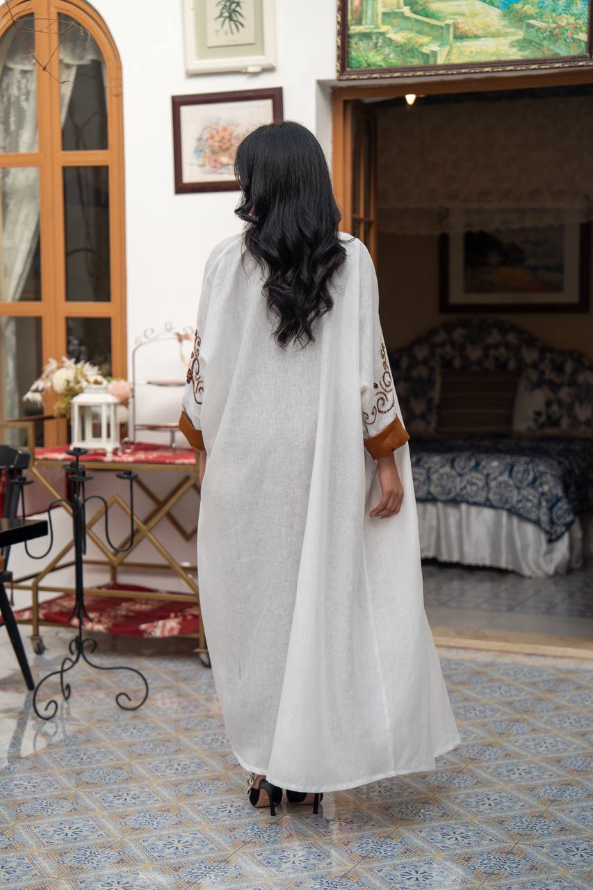 White linen abaya with hand-stitched details. C:J1082