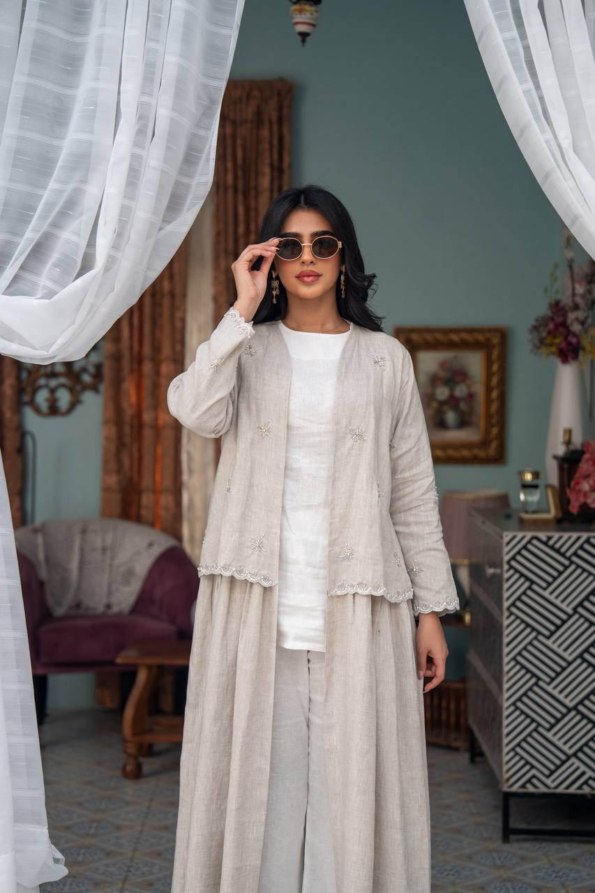 Light beige linen trench coat with hand-stitched detailing.C:J1081