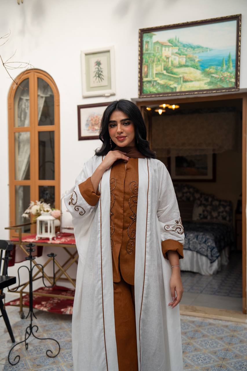 White linen abaya with hand-stitched details. C:J1082