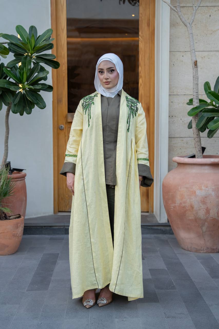 Yellow linen trench coat with hand embroidery and beading.C:1095