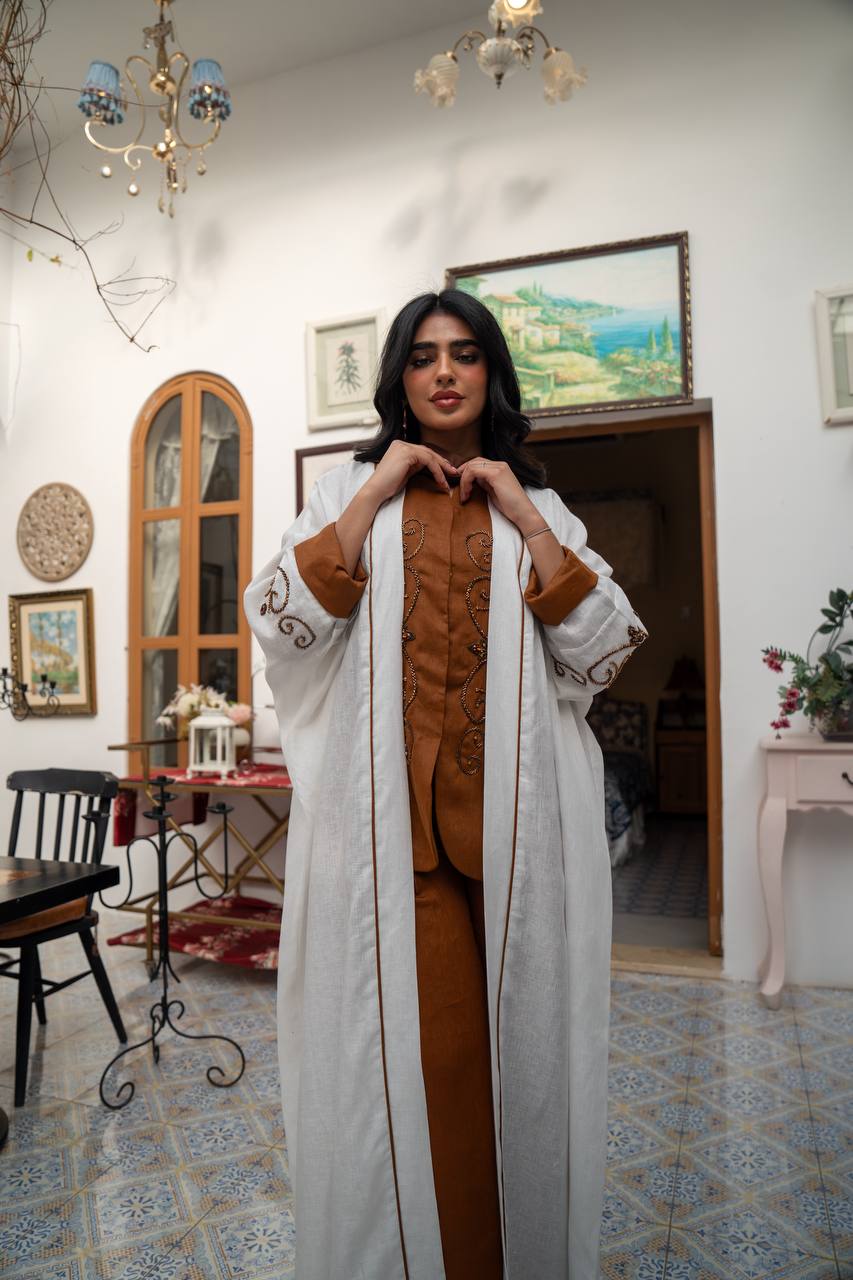 White linen abaya with hand-stitched details. C:J1082