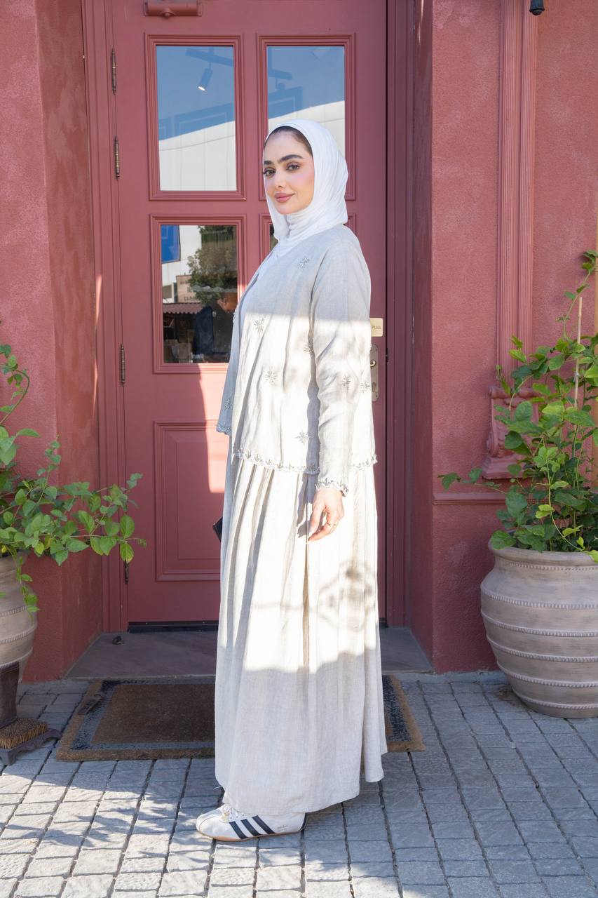 Light beige linen trench coat with hand-stitched detailing.C:J1081