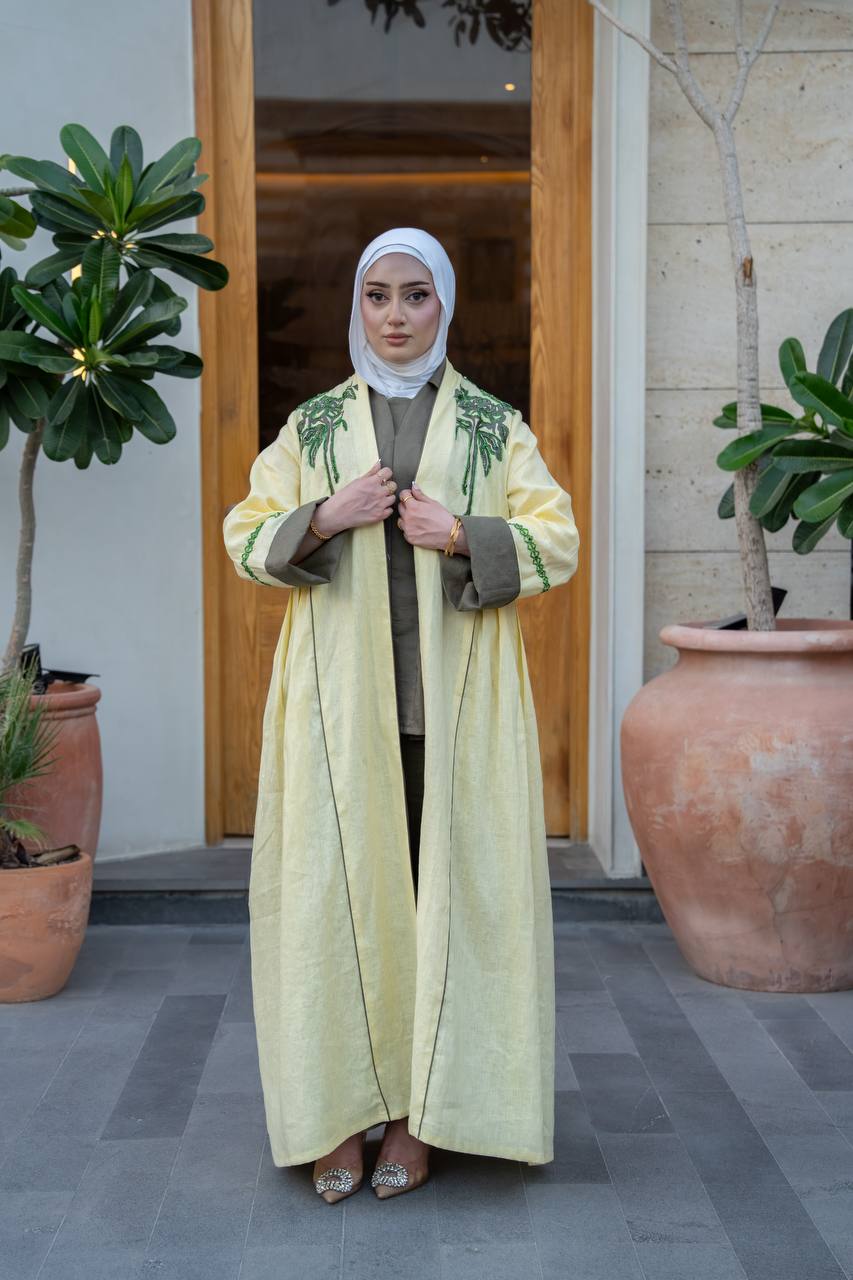 Yellow linen trench coat with hand embroidery and beading.C:1095